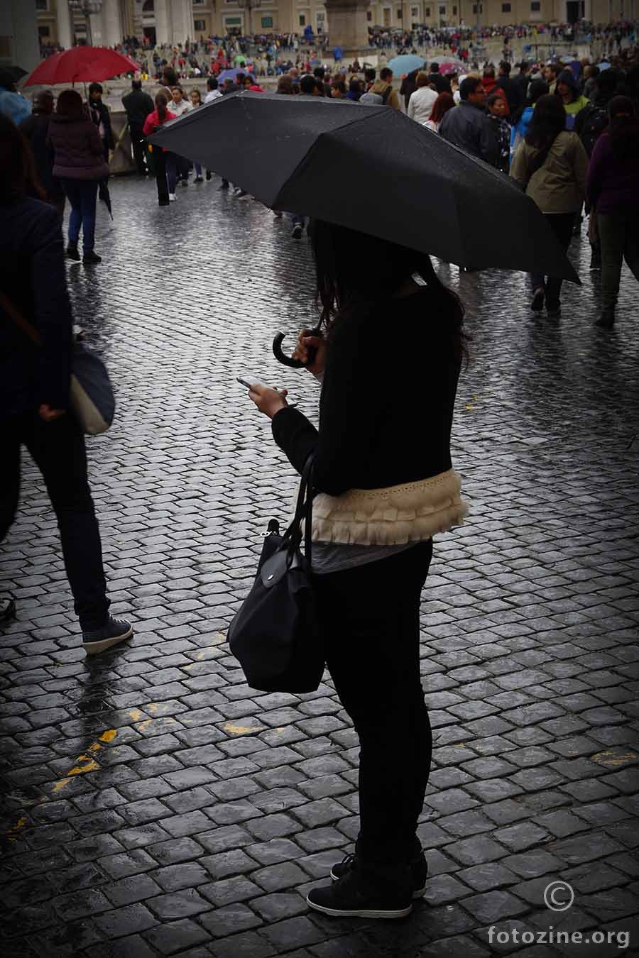 A girl in black on a rainy day